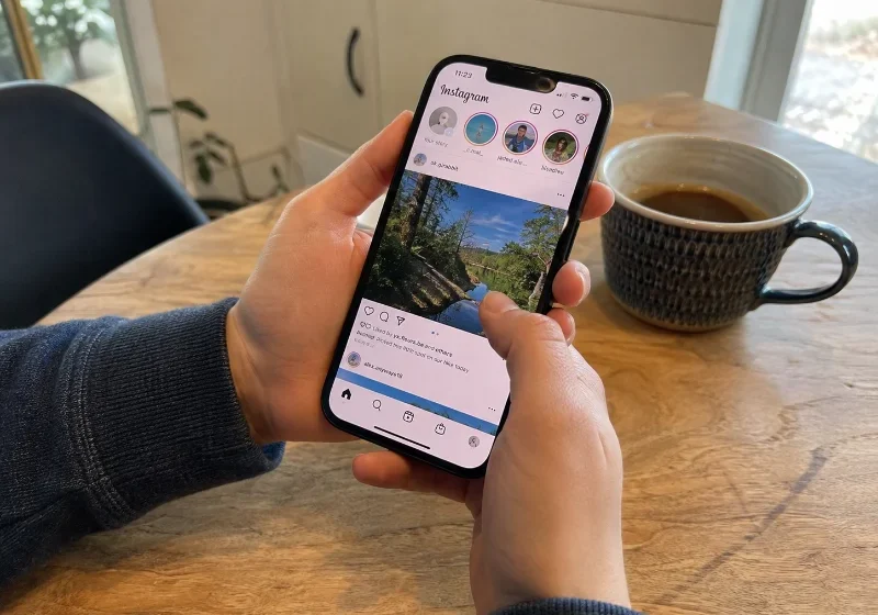 How to Turn Off AI on Instagram (2026 Guide) person checking how to turn off AI on Instagram on their phone